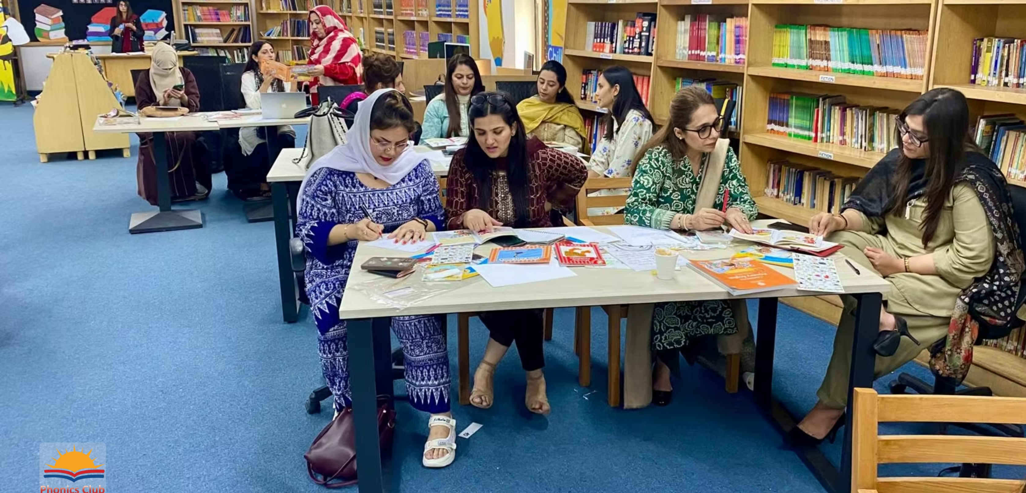 Phonics Club educators working in a library learning session